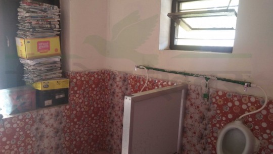 Washroom used as a newspaper store in the Ministry of Economic Affairs and Planning