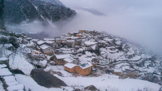 Heavy snowfall disrupts life and election campaigns in Bajura, brings relief to winter crops