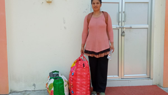 Rekha Thagunna Bist of Bhimdatta-04 Gobariya donates clothes to cloth bank