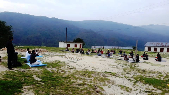 People quarantined in Dadeldhura practice yoga everyday